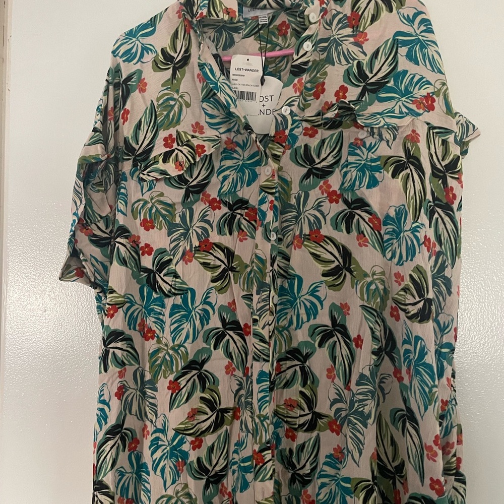 Lost and Wander beach cover up. Light weight w button closure. Never worn.